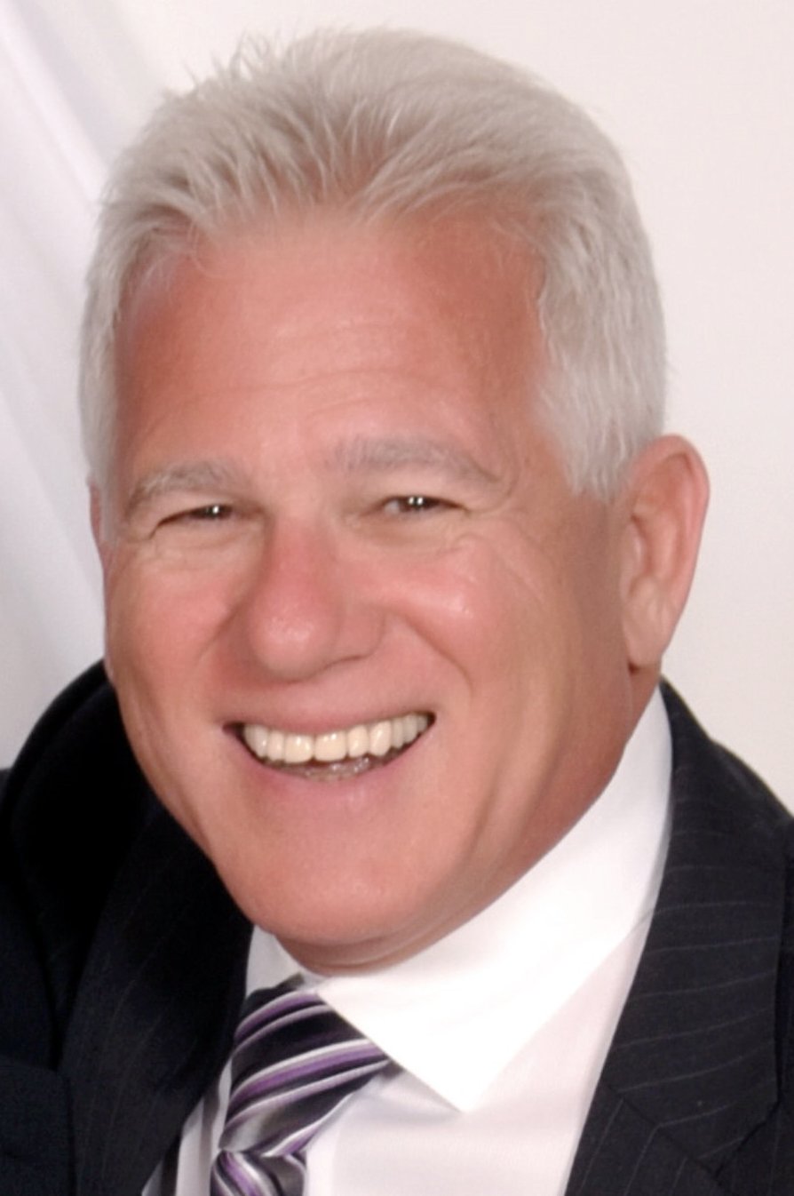 Laurence Scot, MBA CPA, smiling in a suit